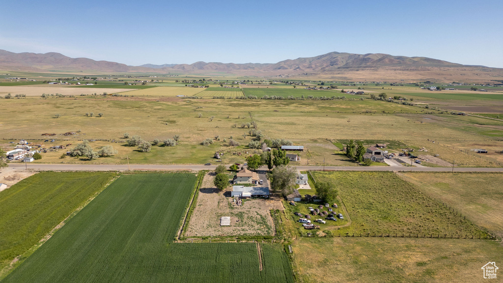 Aerial overview of property's location with rural landscape, a mountain backdrop, and abundant farmland