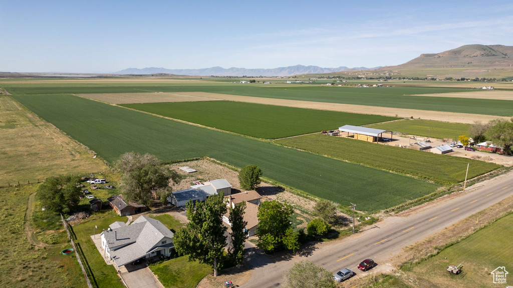 Aerial view of property's location featuring rural landscape, farmland, and a mountainous background