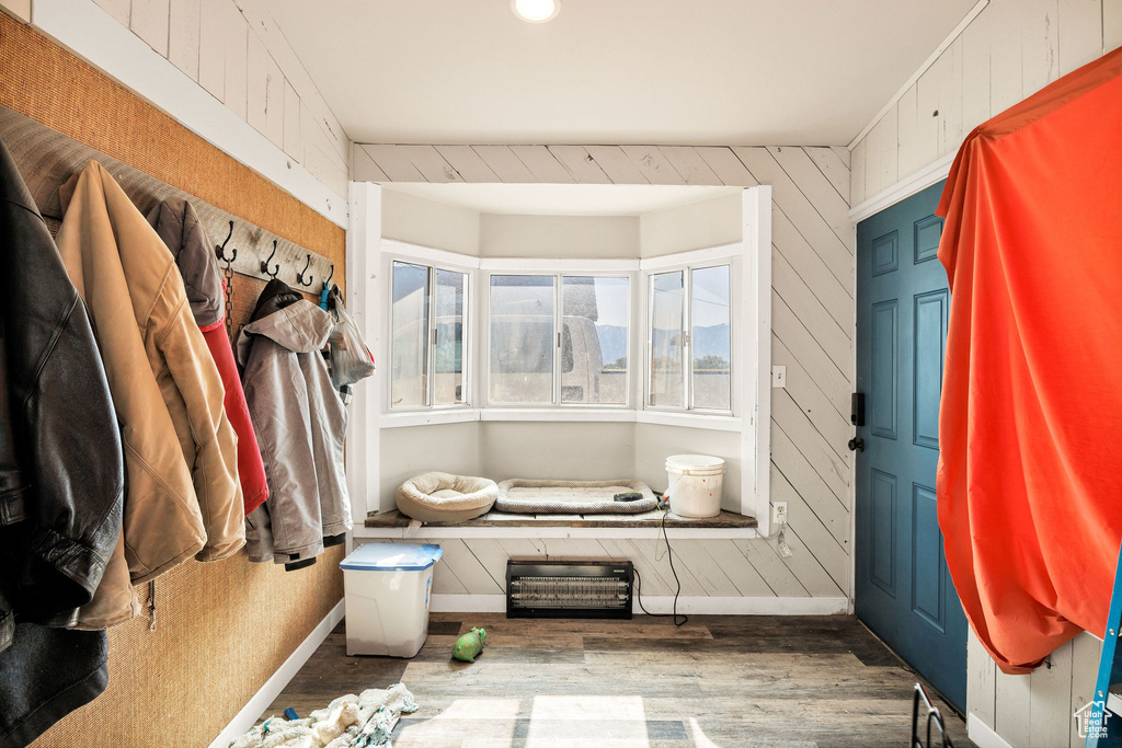 Walk in closet with wood finished floors