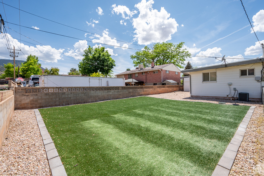 View of yard featuring central AC