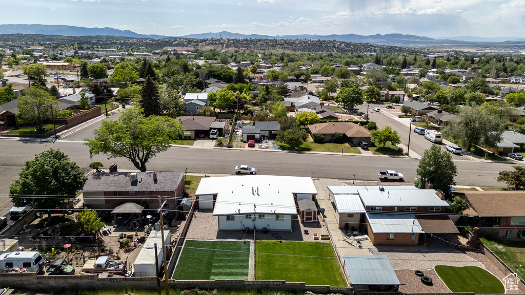 Aerial view of residential area featuring a mountain backdrop