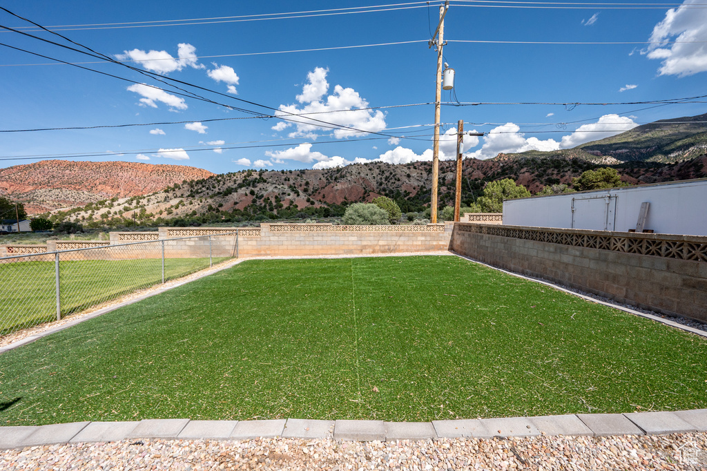 View of yard with a mountain view