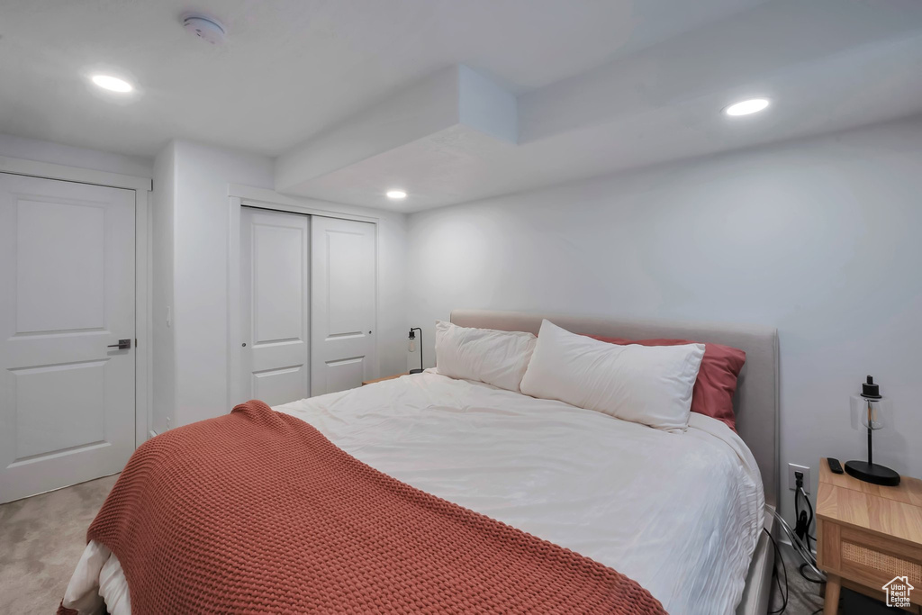 Carpeted bedroom featuring a closet and recessed lighting