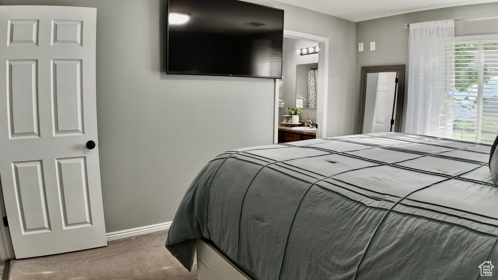 Carpeted bedroom with baseboards