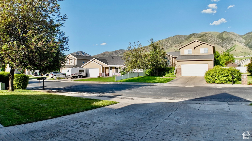 View of decorative road with a residential view and a mountain view
