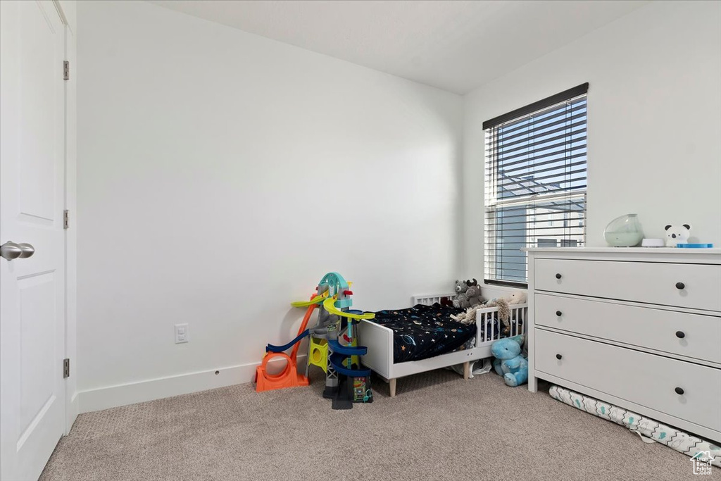Bedroom with carpet and baseboards