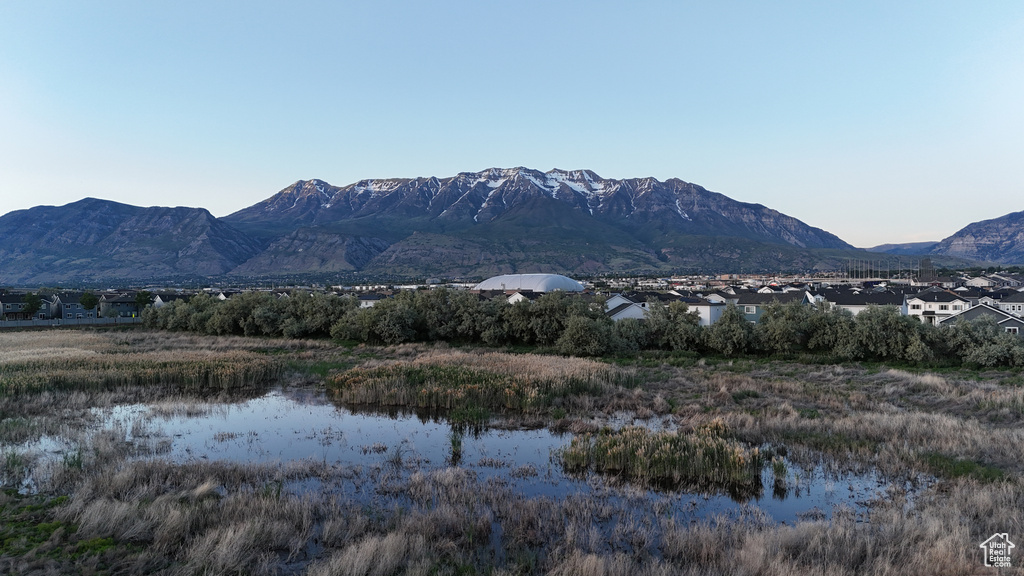 View of mountain backdrop with a nearby body of water