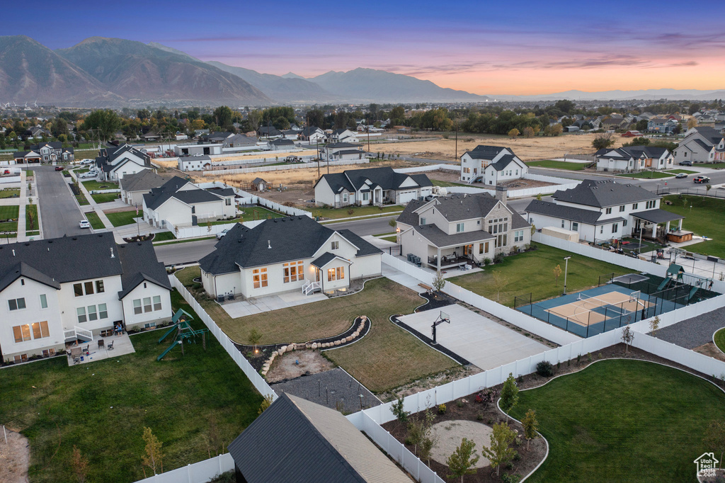 Aerial view of residential area featuring a mountain backdrop