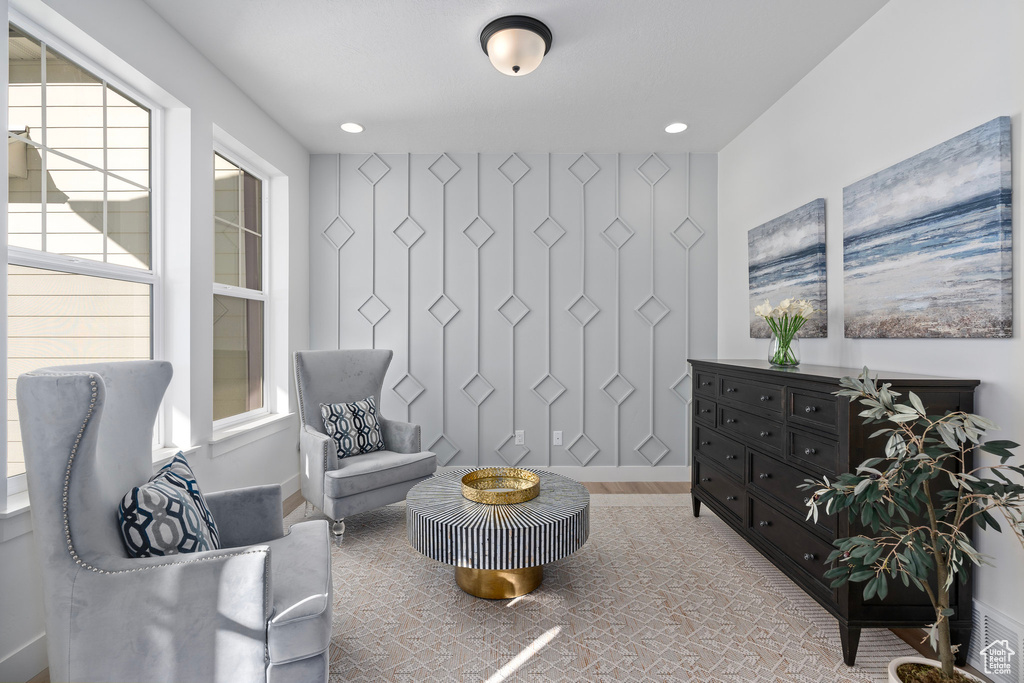 Living area featuring wood finished floors, baseboards, and recessed lighting