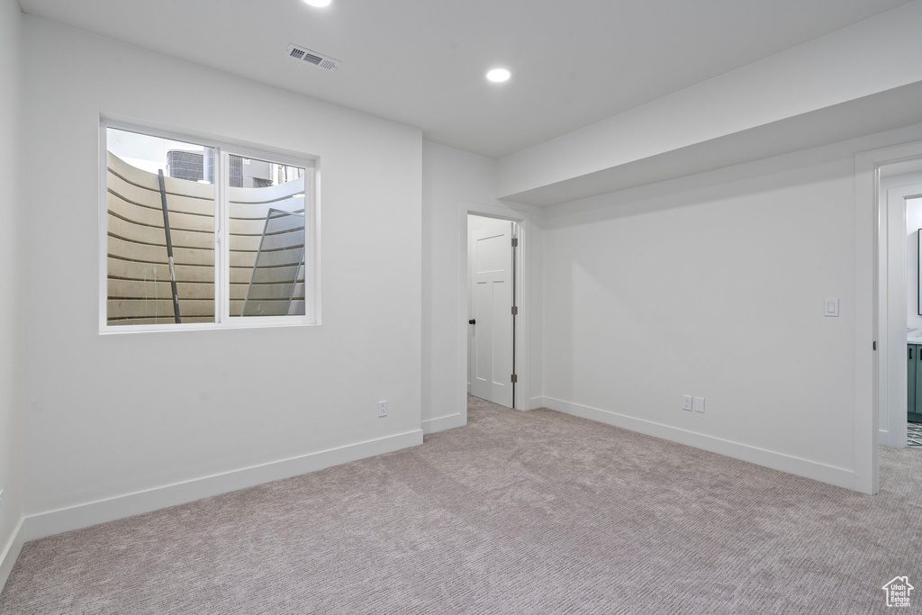 Unfurnished bedroom with carpet flooring, baseboards, and recessed lighting