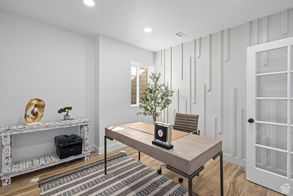 Office area featuring light wood-style flooring, recessed lighting, and baseboards