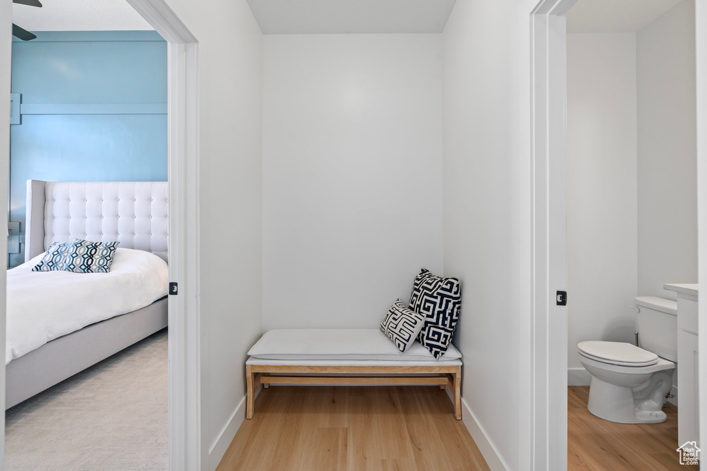 Bedroom featuring wood finished floors and baseboards