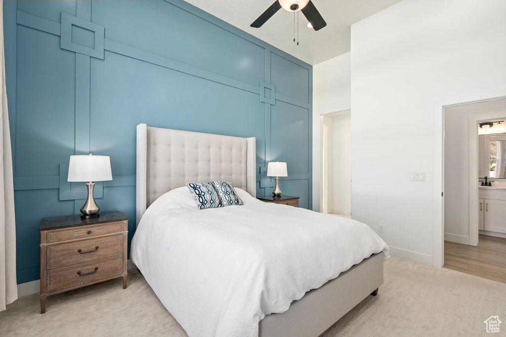 Bedroom with baseboards, a sink, and a ceiling fan