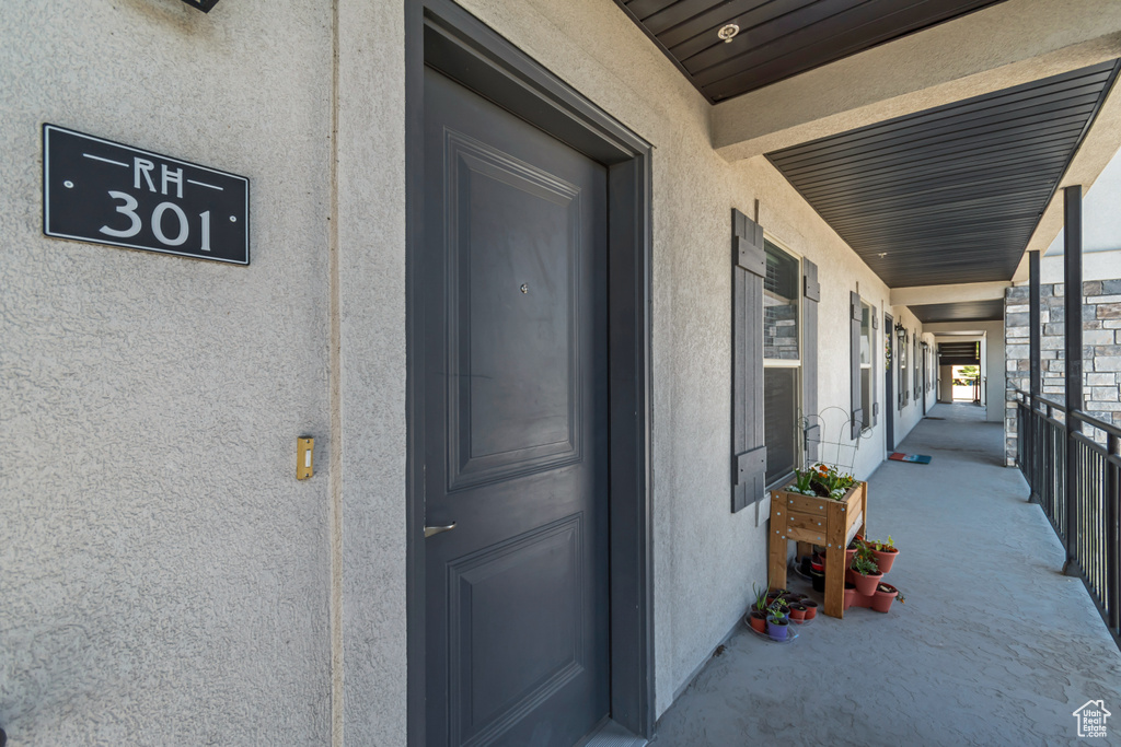 Property entrance featuring stucco siding