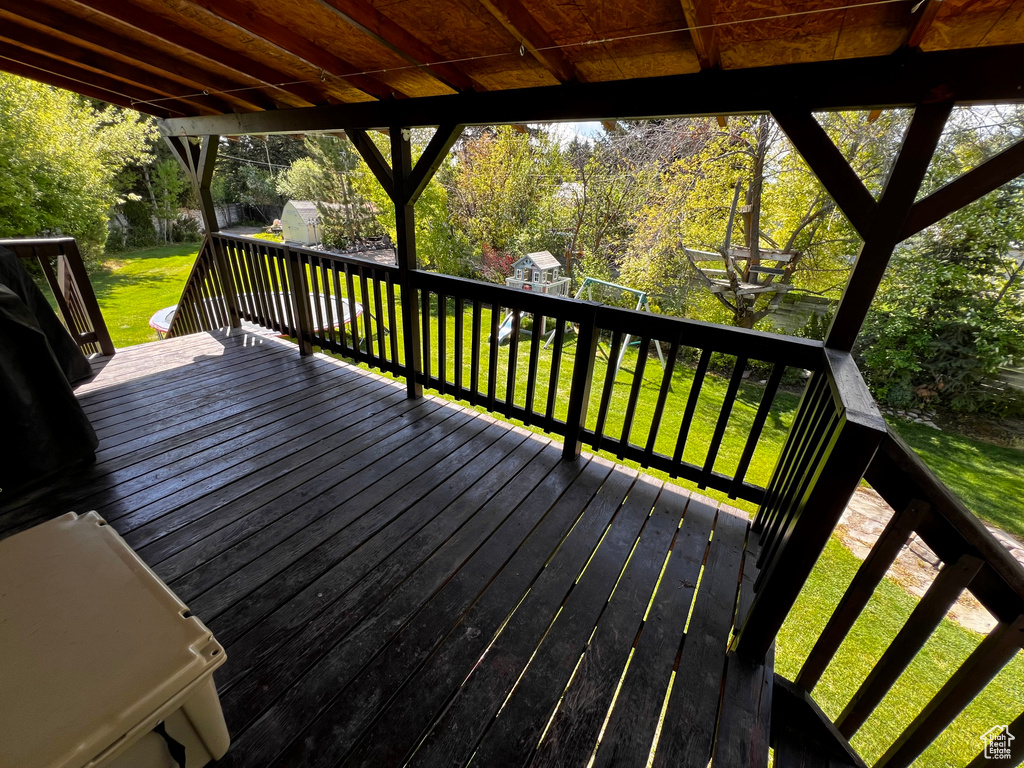 Wooden terrace with a lawn