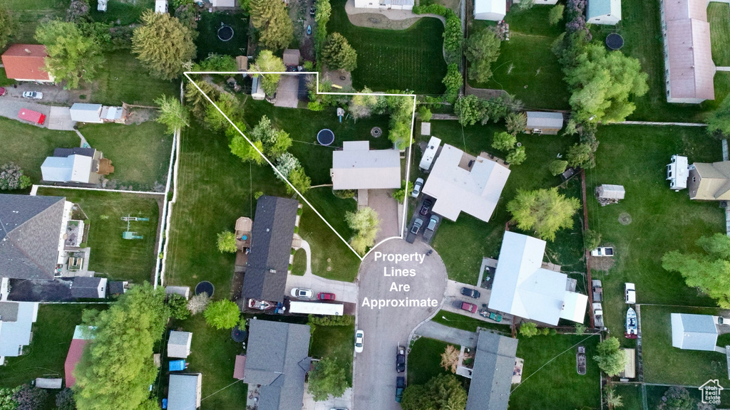 Aerial perspective of suburban area featuring property parcel outlined