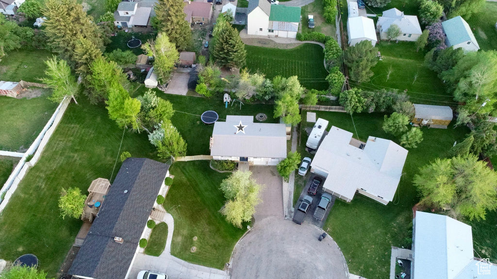 Aerial view of property and surrounding area with nearby suburban area