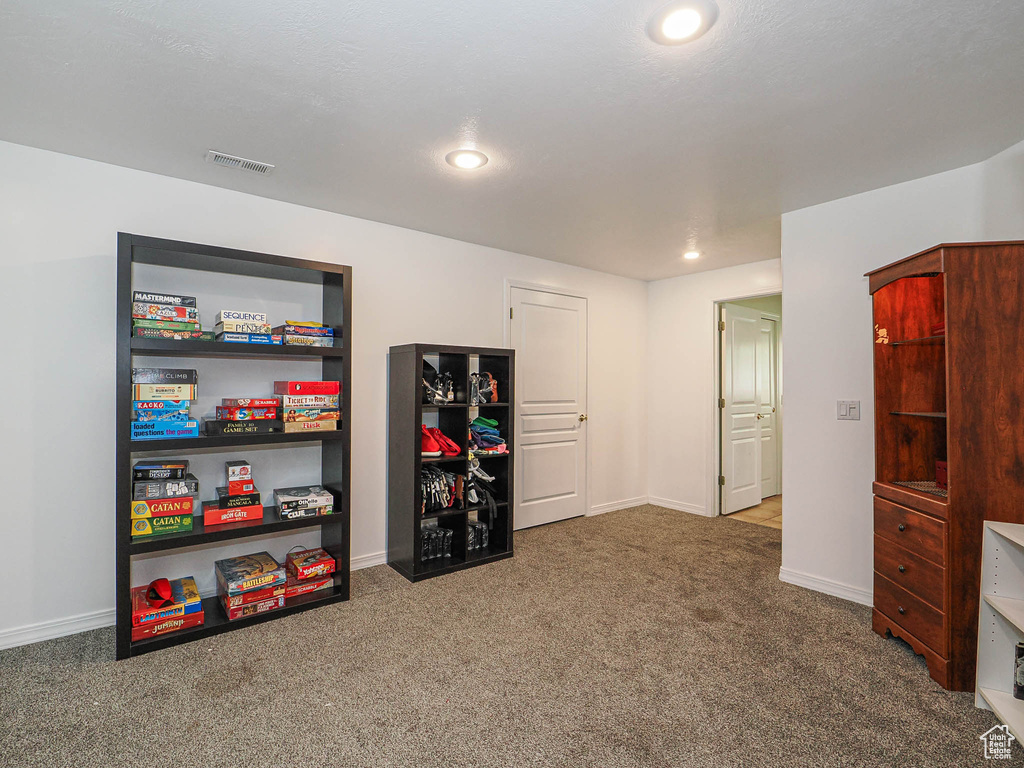 Rec room featuring carpet flooring, baseboards, and recessed lighting