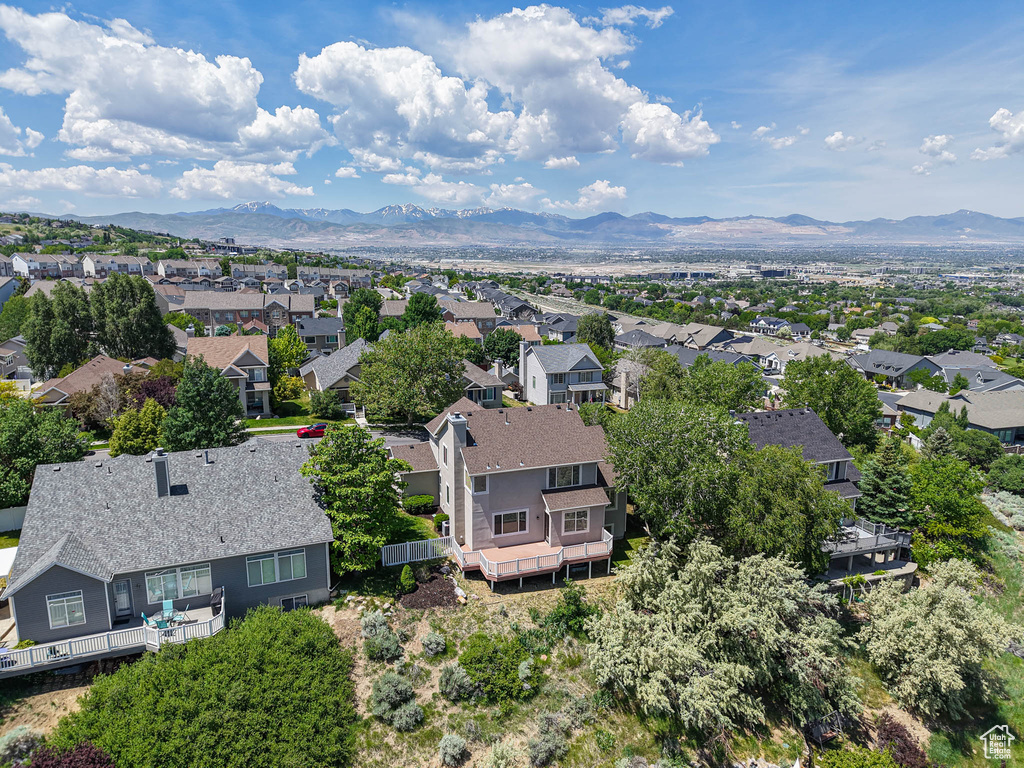 Aerial perspective of suburban area featuring a mountain backdrop
