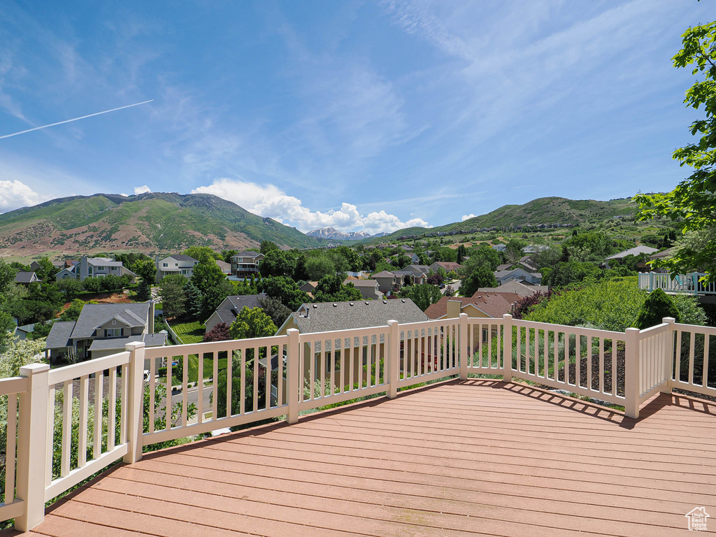 Wooden deck with a mountain view and a residential view