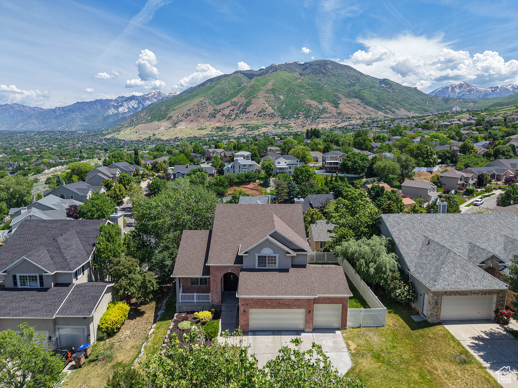 Aerial view of residential area with a mountainous background