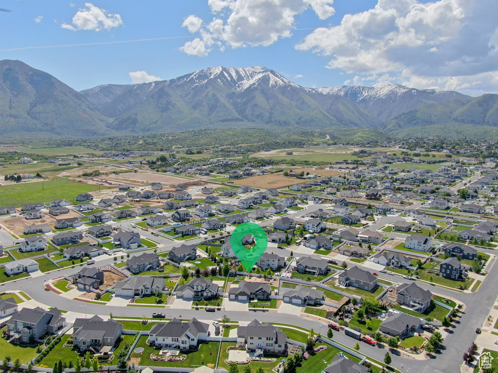 Aerial perspective of suburban area with a mountain backdrop