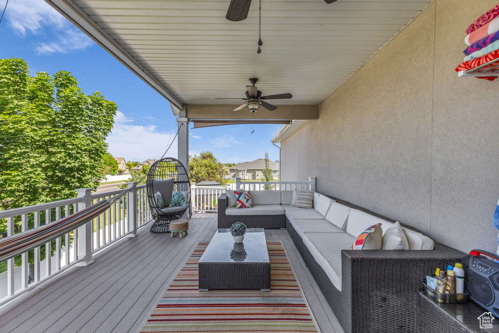 Deck with ceiling fan and outdoor lounge area