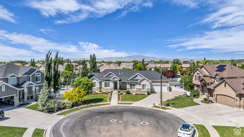 Aerial perspective of suburban area with a mountain backdrop