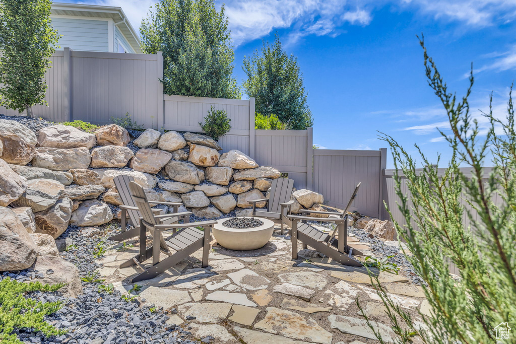 View of patio / terrace with an outdoor fire pit