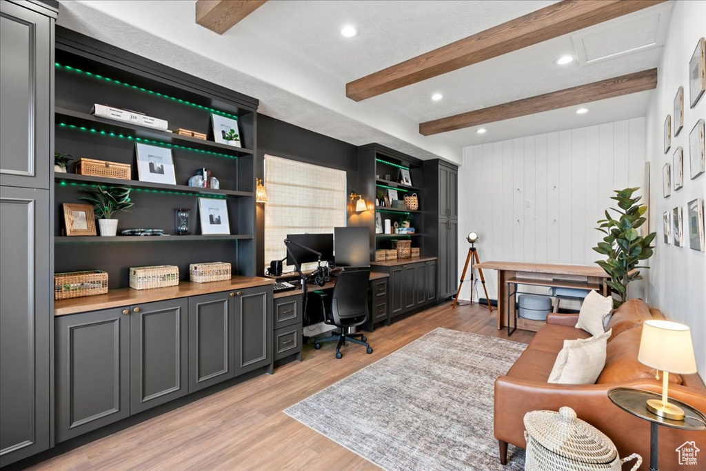 Office with beam ceiling, light wood finished floors, and recessed lighting