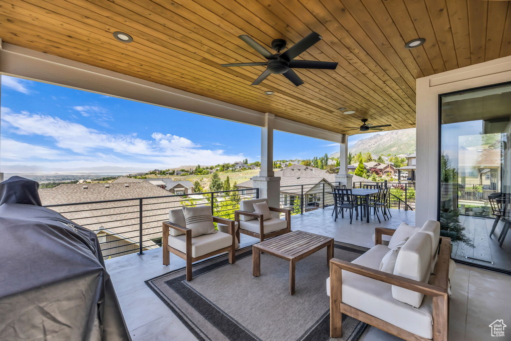 View of patio with ceiling fan, outdoor lounge area, a residential view, and a balcony