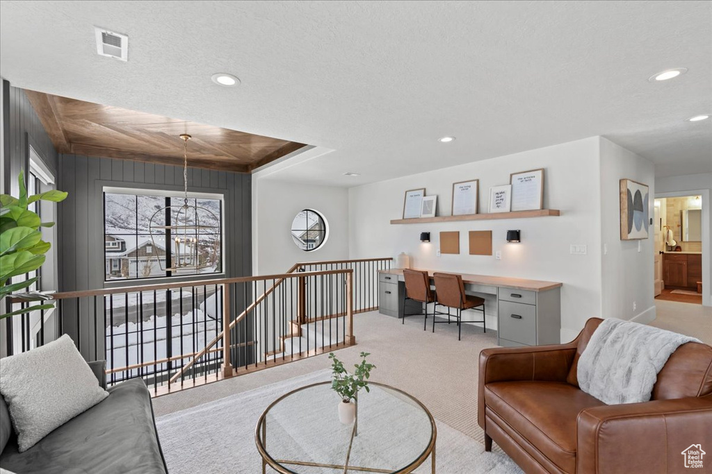 Carpeted living area featuring recessed lighting