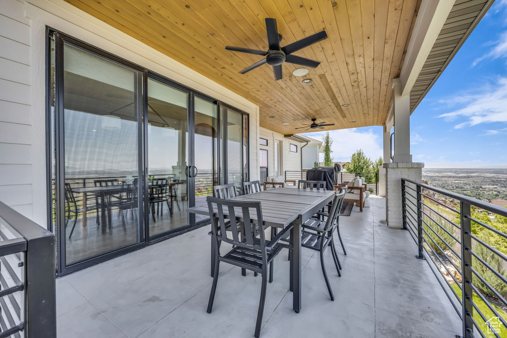 View of patio with a ceiling fan and outdoor dining space