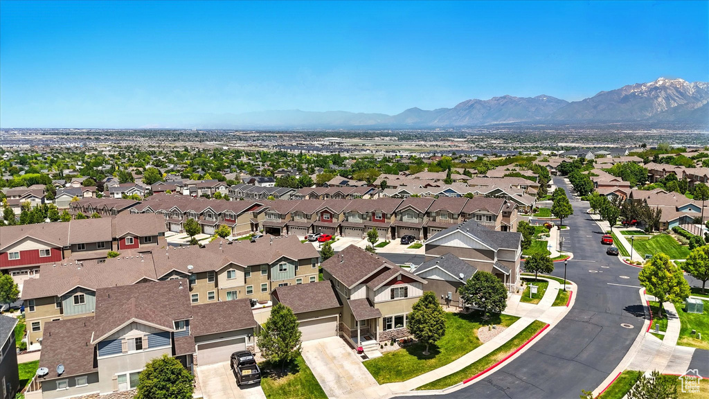 Aerial view of residential area featuring mountains