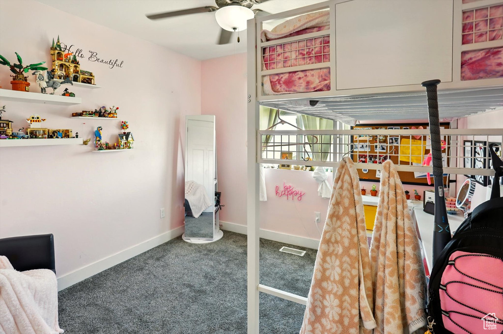 Bedroom with carpet floors and baseboards
