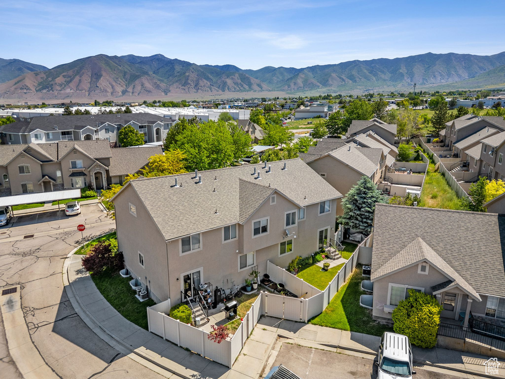 Aerial view of residential area with a mountainous background