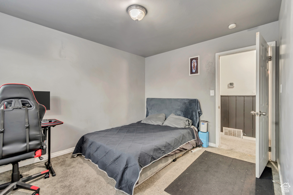 Carpeted bedroom with baseboards