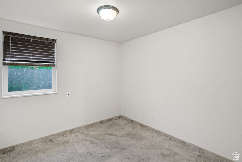 Unfurnished room featuring baseboards