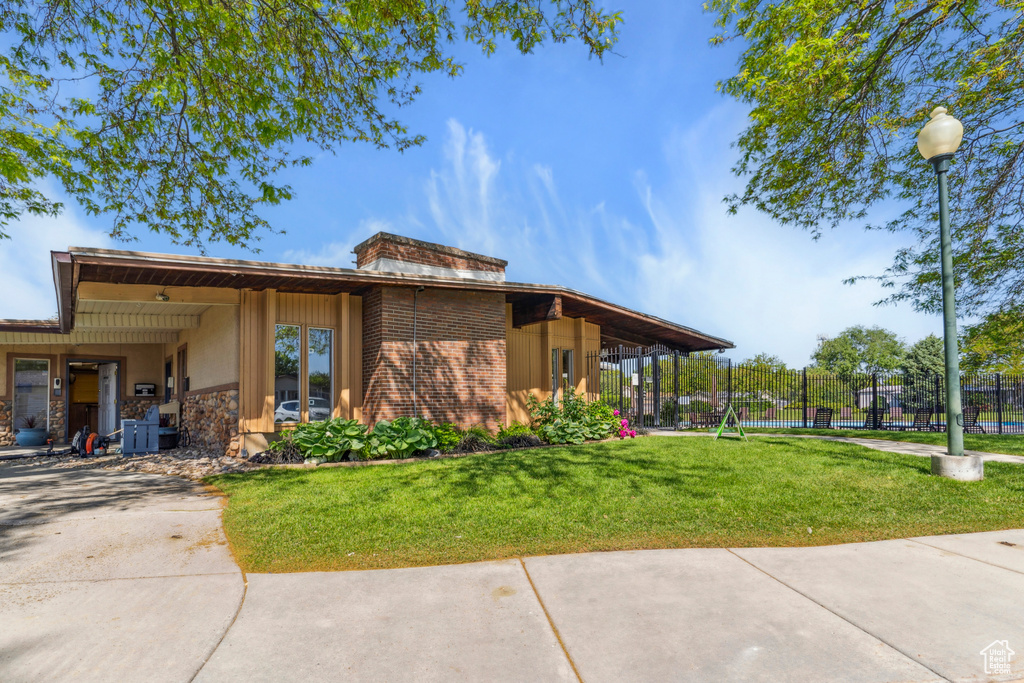 View of front of house with stone siding