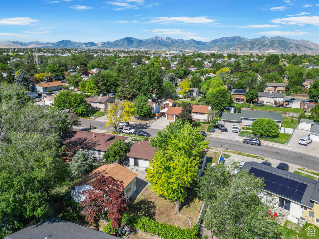 Aerial perspective of suburban area with a mountain backdrop