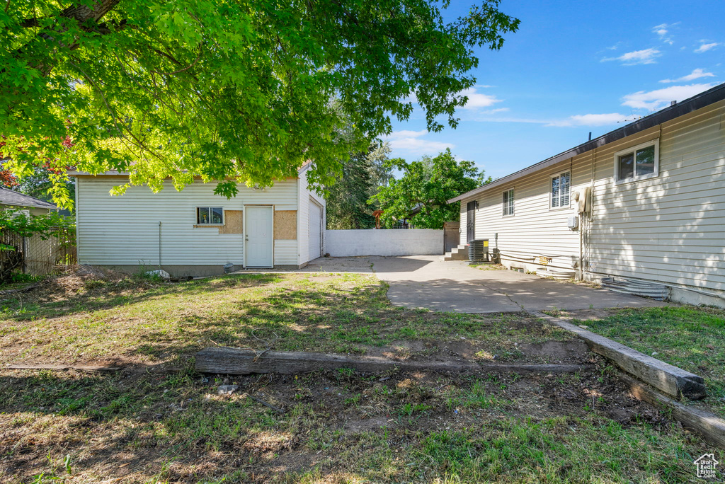 View of yard featuring a patio and cooling unit