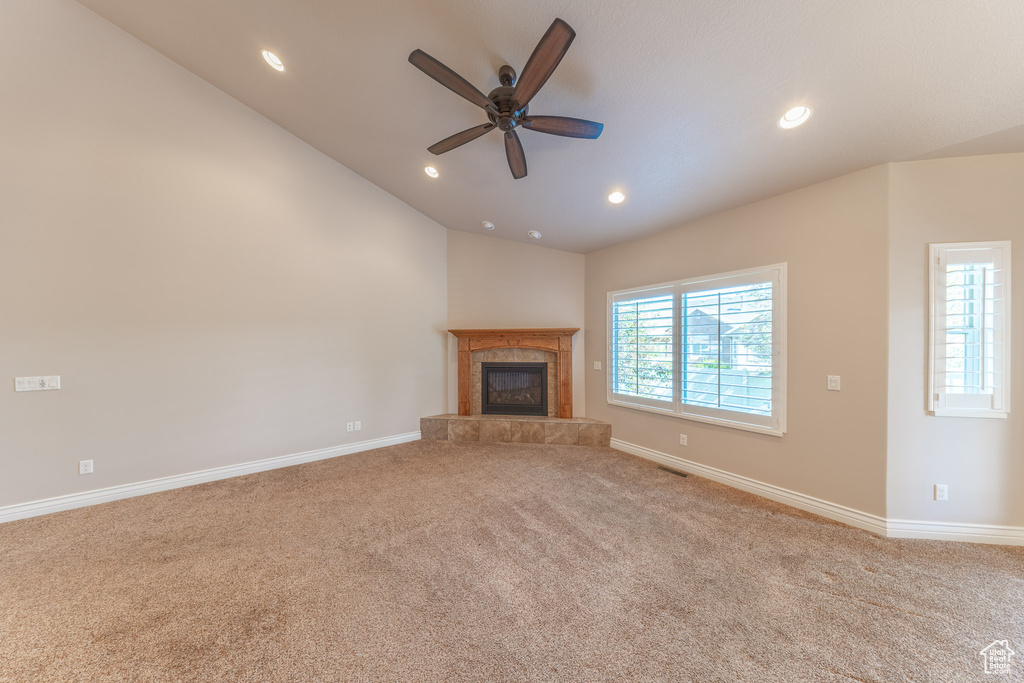 Unfurnished living room with carpet flooring, a fireplace, a ceiling fan, recessed lighting, and baseboards
