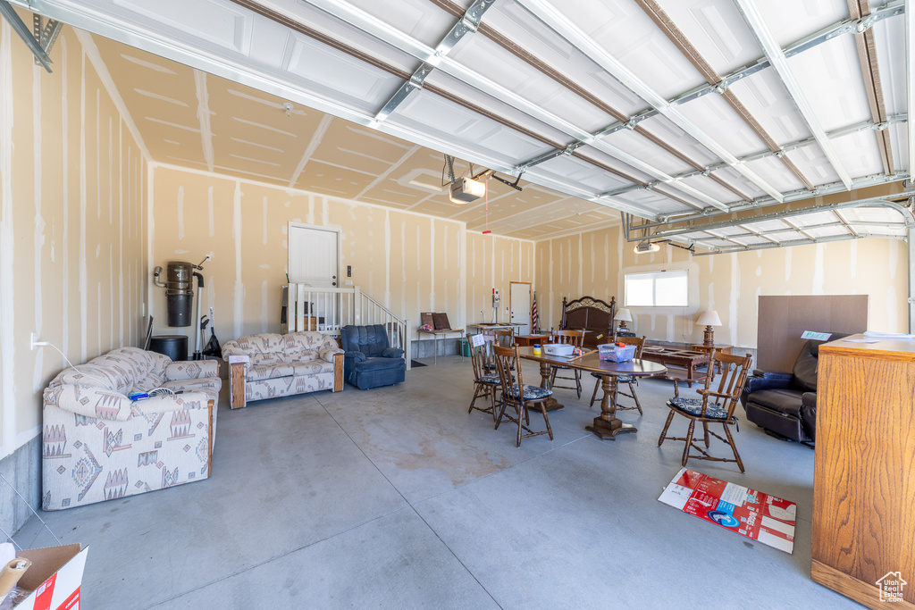 Garage featuring a garage door opener and a central vacuum unit