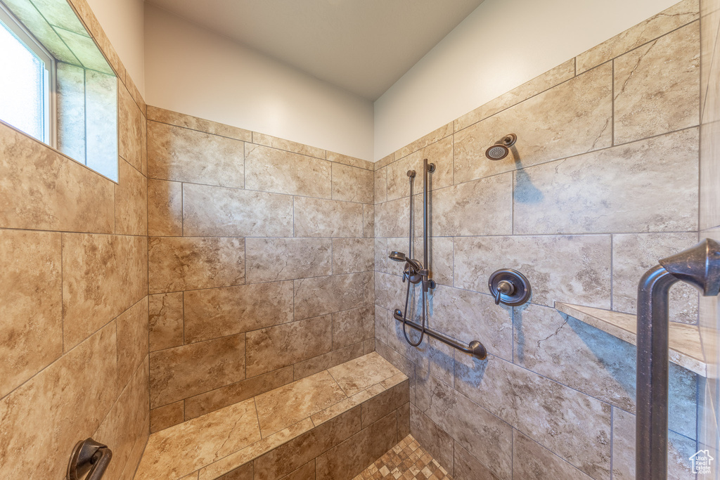 Bathroom featuring a tile shower