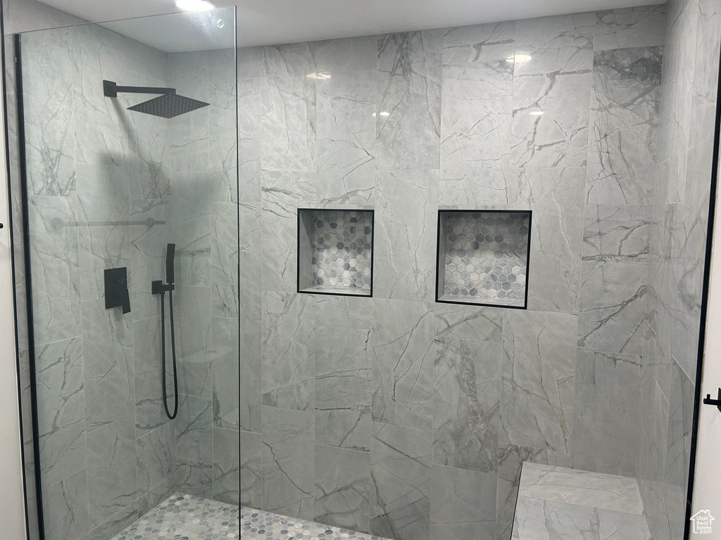 Bathroom with a marble finish shower