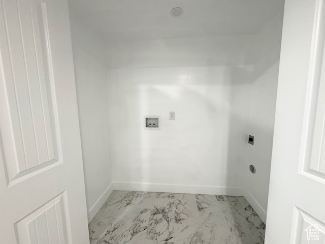 Laundry area with electric dryer hookup, marble finish flooring, baseboards, and washer hookup