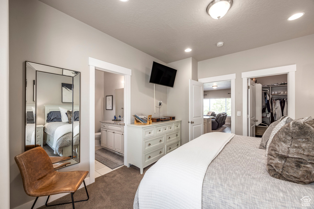Bedroom featuring carpet flooring, a spacious closet, connected bathroom, recessed lighting, and a closet