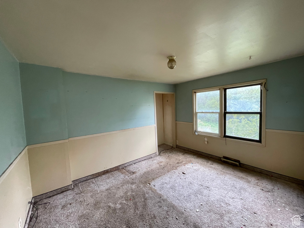 Spare room featuring baseboards
