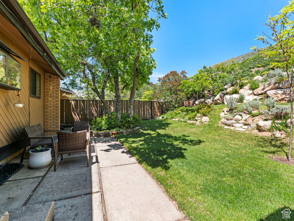 View of yard with a patio