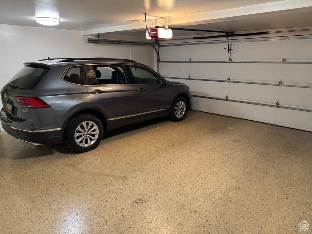 Garage featuring a garage door opener